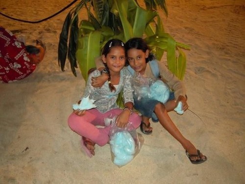 Two local girls enjoying the Heiva Nue festival on Bora Bora © www.takingthekids.com